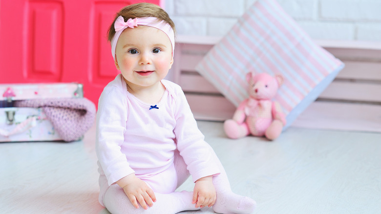 baby with pink headband