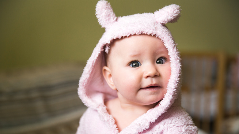 baby with pink towel hood and ears