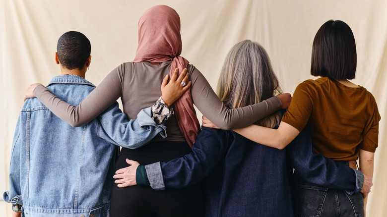 Four women embracing 