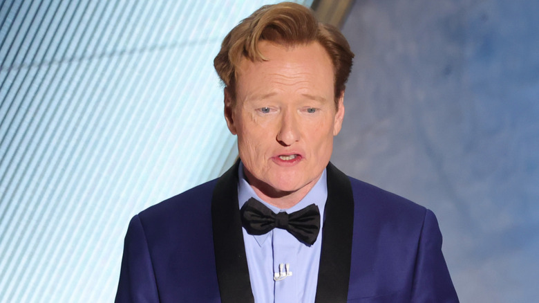 Conan O'Brien on stage at the Oscars, hosting the event