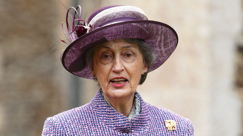 Lady Susan Hussey grimacing in purple outfit