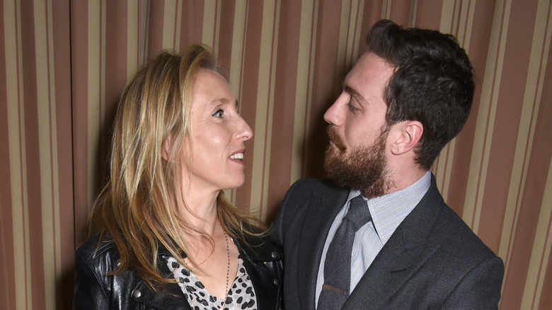 Aaron Taylor-Johnson looking at Sam Taylor-Johnson