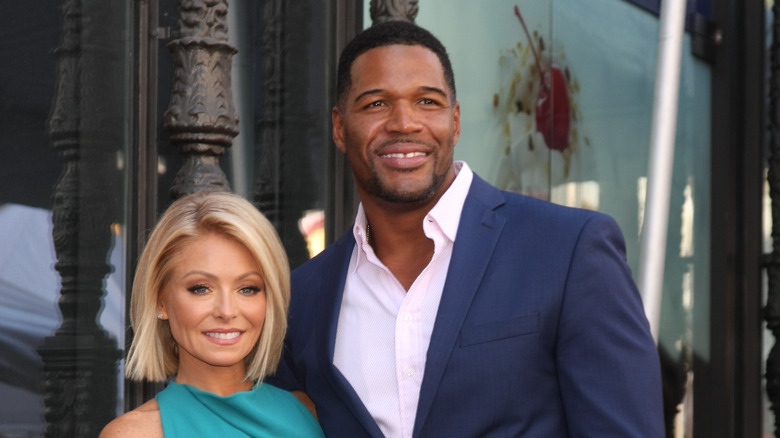 Kelly Ripa posing beside former "Live!" co-host Michael Strahan