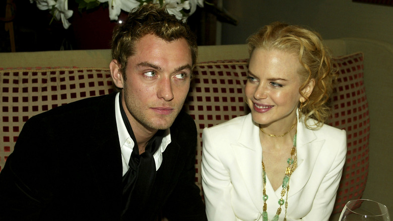 Jude Law and Nicole Kidman sitting together at the "Cold Mountain" afterparty