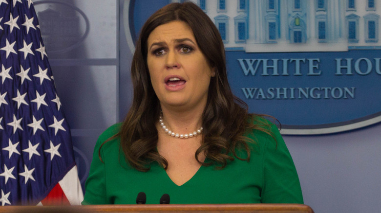 Sarah Huckabee Sanders delivering a press briefing