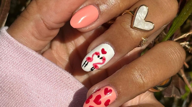 Woman with pink coral nails 