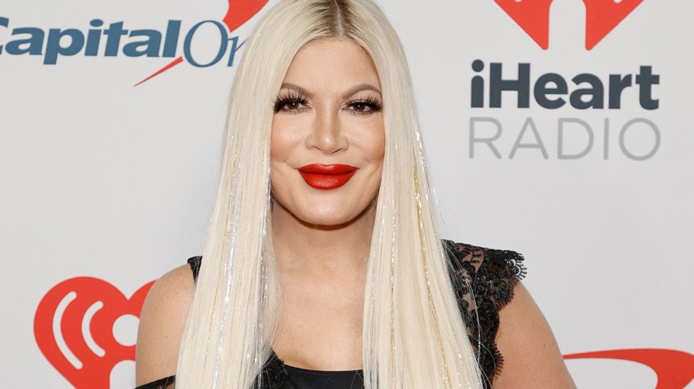 Tori Spelling wears red lipstick at event in 2021