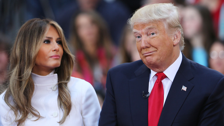 Melania looks at Donald Trump