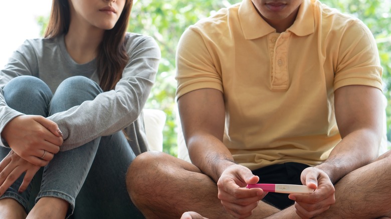 Couple taking pregnancy test