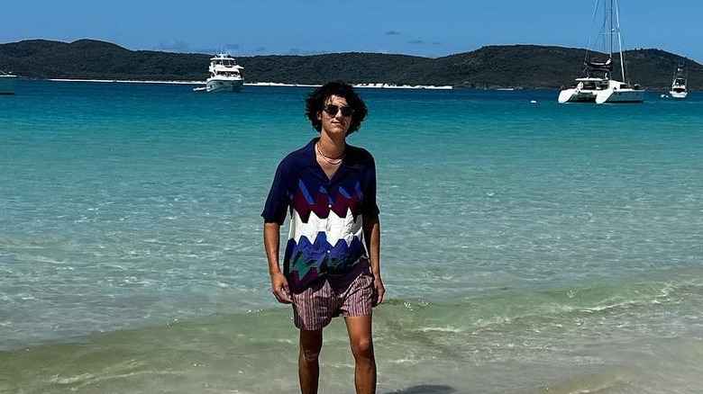 Count Nikolai on the beach in Australia, walking