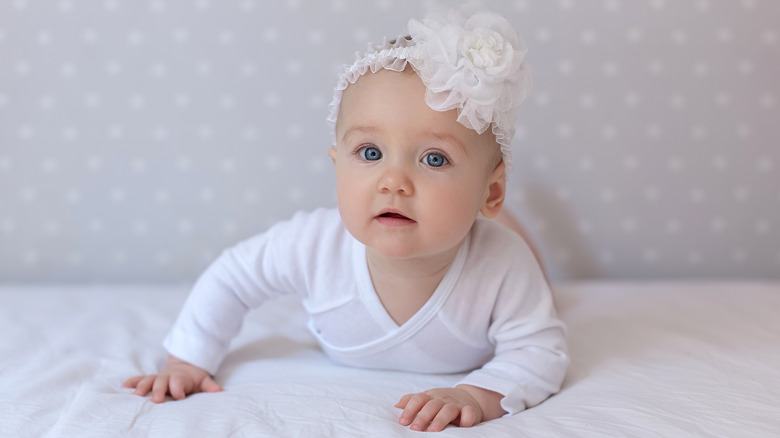 Baby with white bow