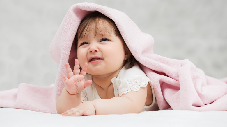 Baby girl in pink blanket