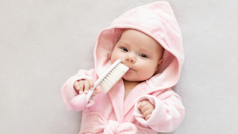 Baby girl in pink robe