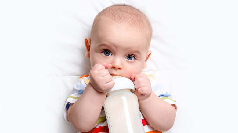 Baby drinking out of bottle