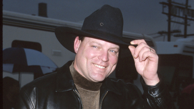 John Michael Montgomery smiling in a cowboy hat