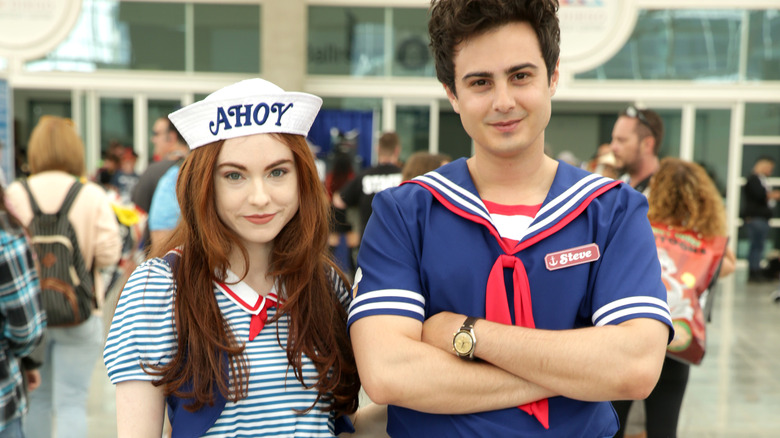 Couple dressed as Robin and Steve from "Stranger Things"