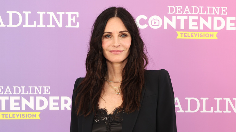 Courteney Cox smiling at an event