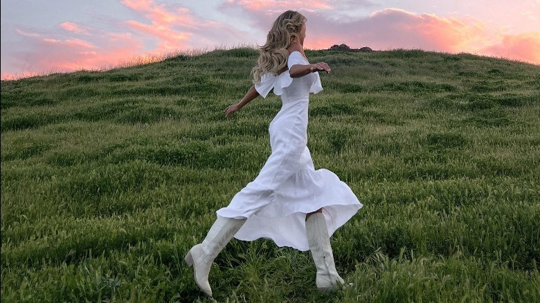 white flowy dress with cowboy boots