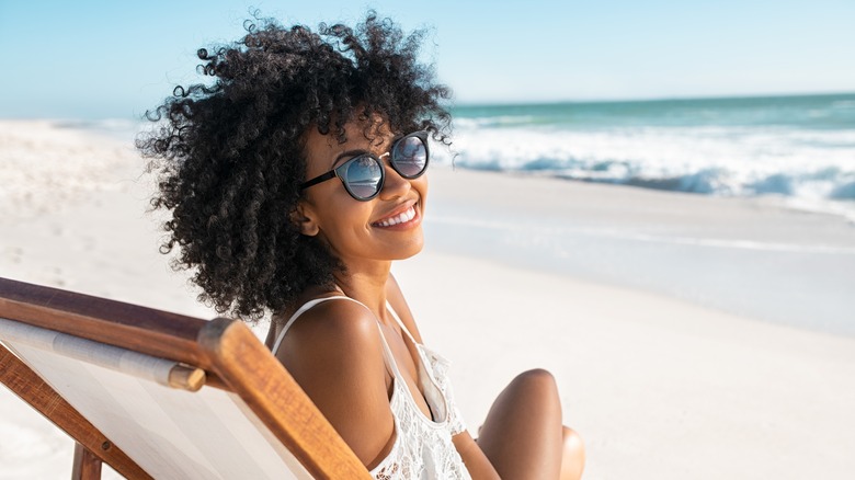 Woman smiles on the beach