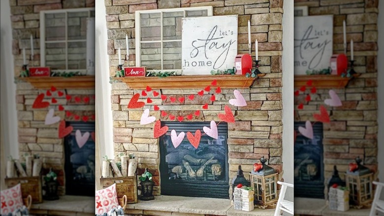 Stone fireplace let's stay home sign