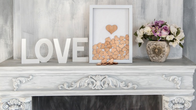 white marble mantel love sign