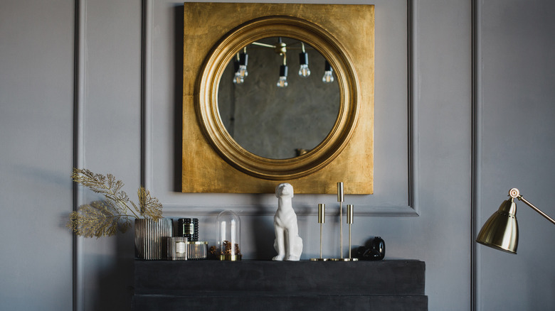 Gold round mirror on wall