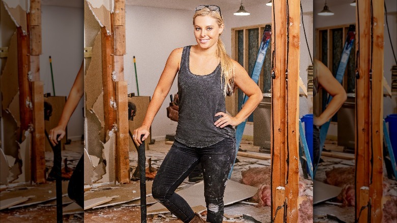 Cristy Lee posing with a hammer