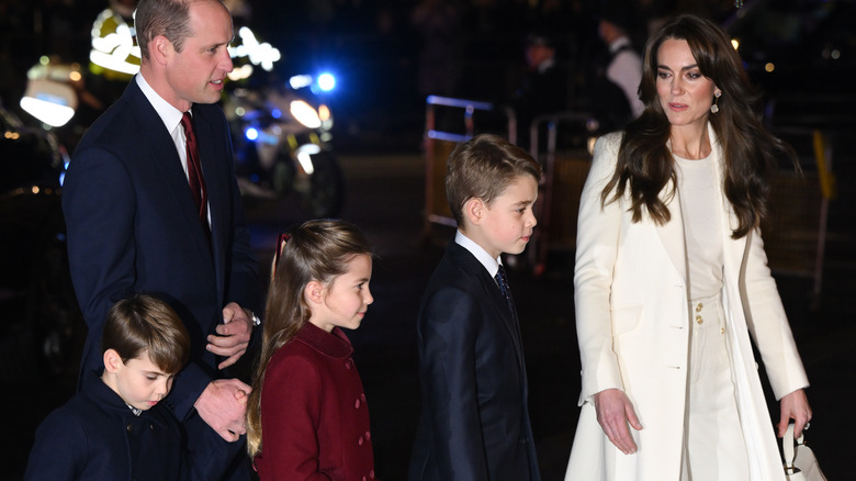 Prince William and Kate Middleton walk with three children