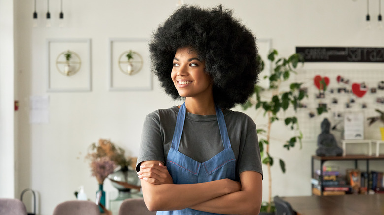 Woman with afro hair smiling