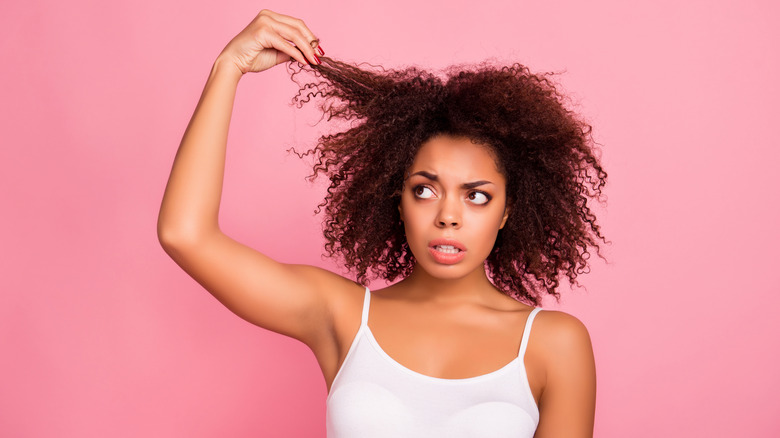 Woman pulling at hair