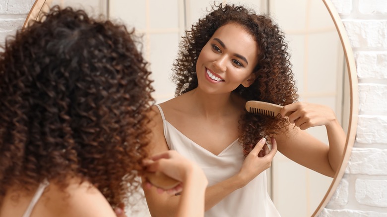 Woman combing her hair