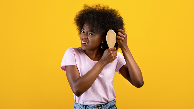 Woman brushing her hair