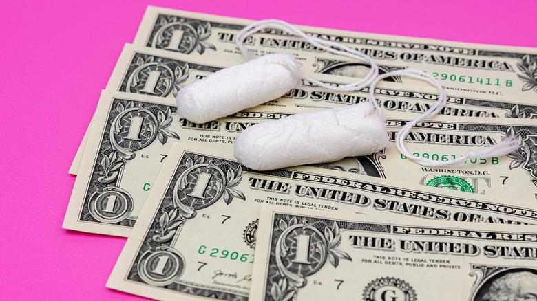 Tampons on dollar bills