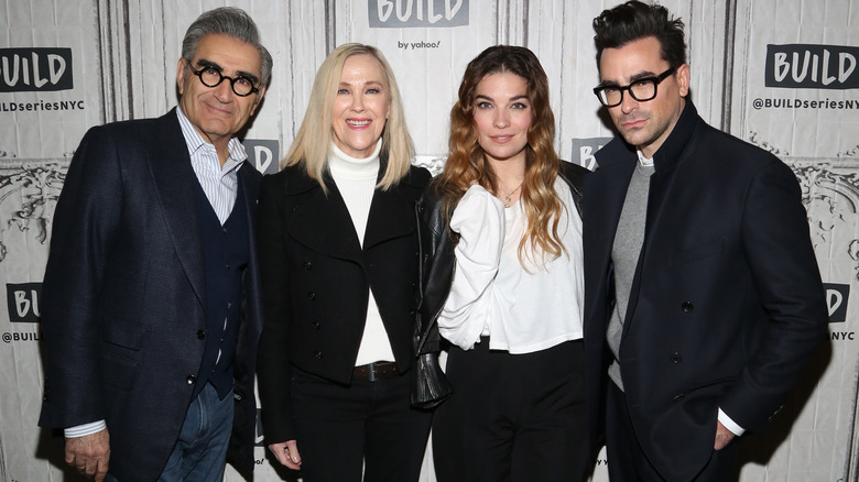 Eugene Levy, Catherine O'Hara, Annie Murphy, and Dan Levy posing at an event