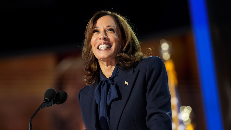 Kamala Harris looking up and smiling at podium DNC