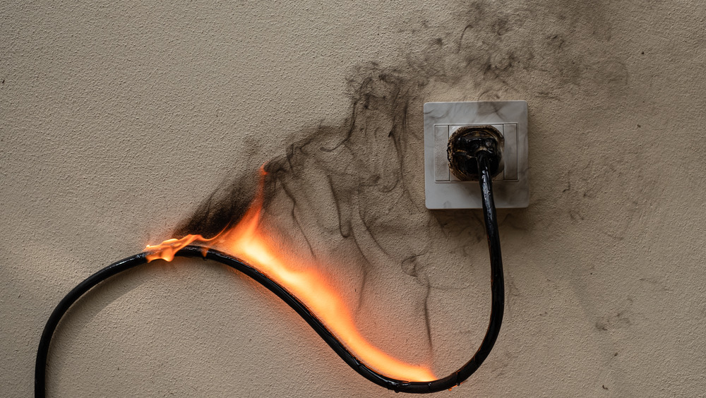 Plugged-in cord on fire 