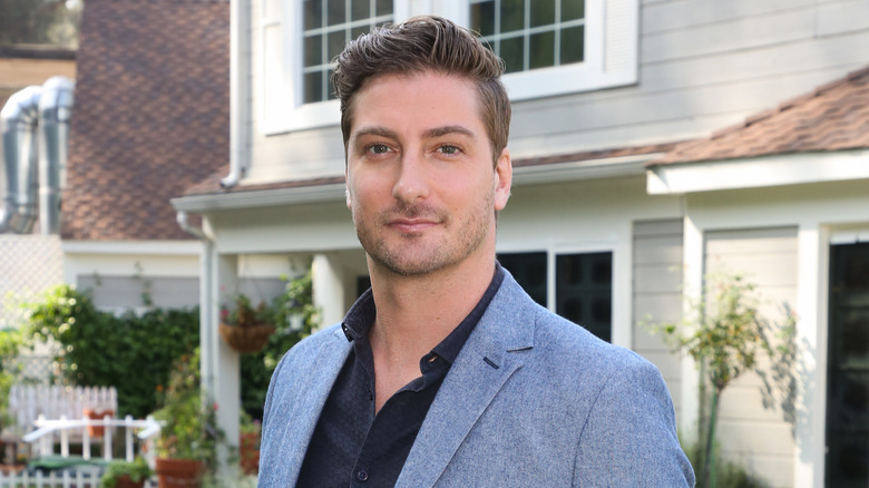 Daniel Lissing wearing blue jacket