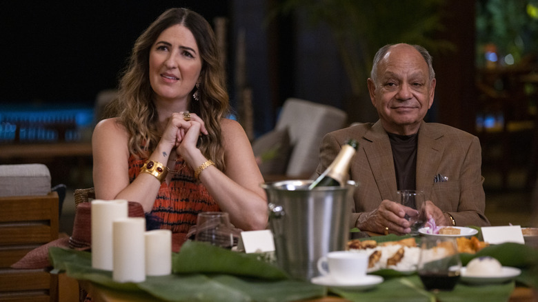 D'Arcy Carden and Cheech Marin sitting at dinner table in Shotgun Wedding
