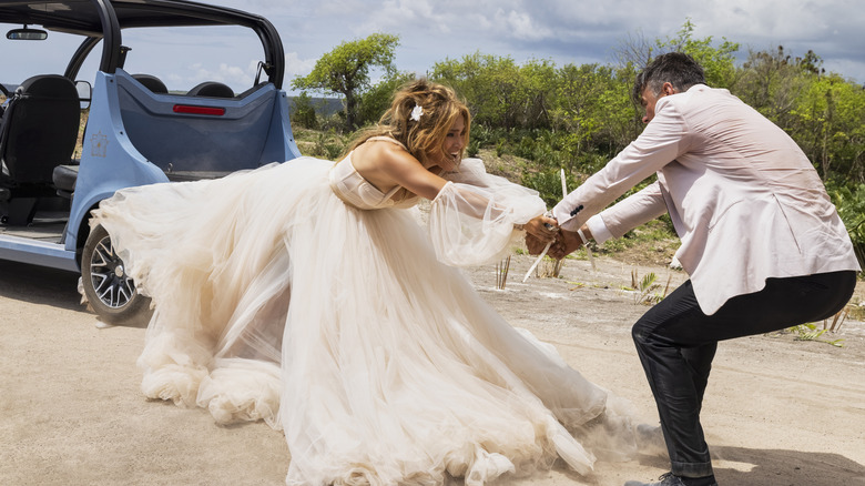 Josh Duhamel pulling Jennifer Lopez in Shotgun Wedding