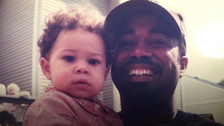 Darius and baby Carolyn Rucker smiling