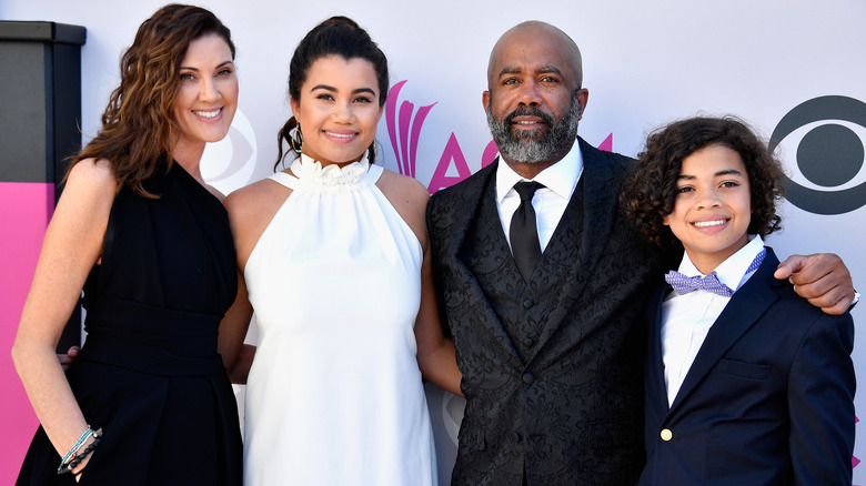 Darius Rucker, Beth Leonard, Daniella Rucker, and Jack Rucker smiling