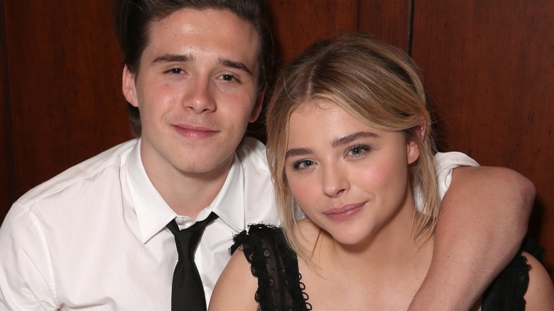 Brooklyn Beckham throwing an arm around Chloë Grace Moretz