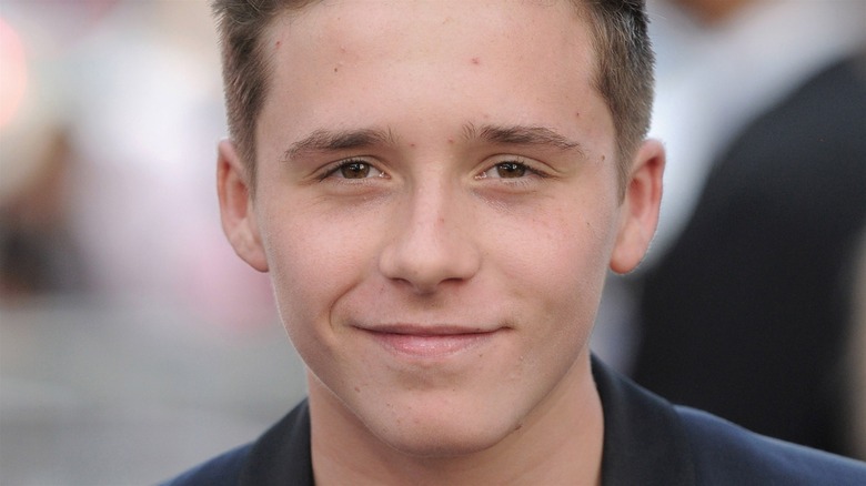 Teenage Brooklyn Beckham smiling