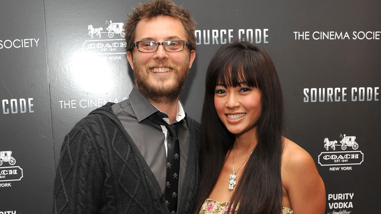 Duncan Jones and Rodene Ronquillo smiling at Source Code premiere