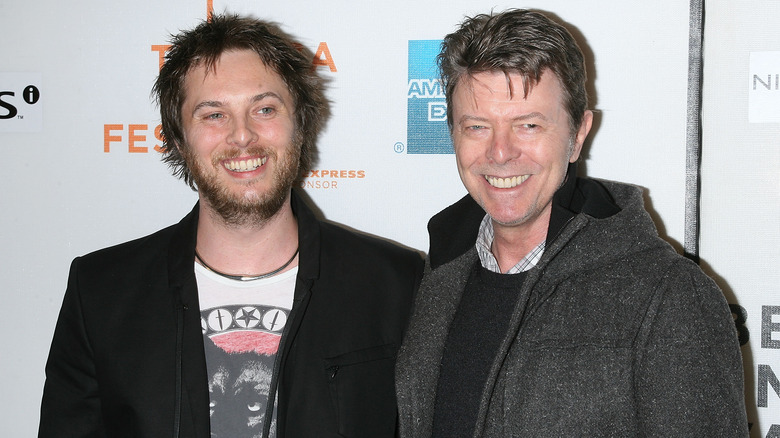 Duncan Jones and David Bowie smiling at the Tribeca Film Festival