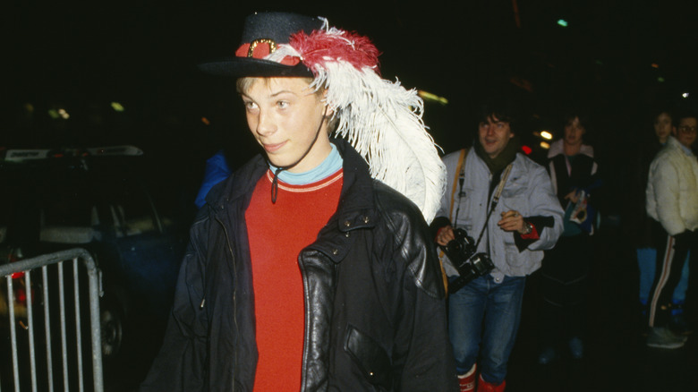 Duncan Jones wearing a hat with feathers