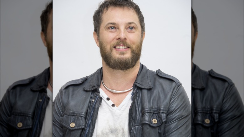 Duncan Jones smiling at Mute press conference in the Four Seasons Hotel