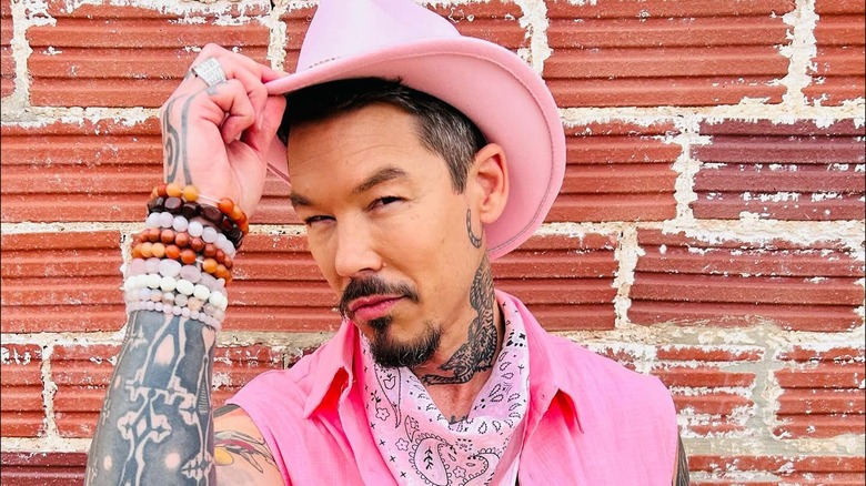 David Bromstad looking serious dressed as a pink cowboy