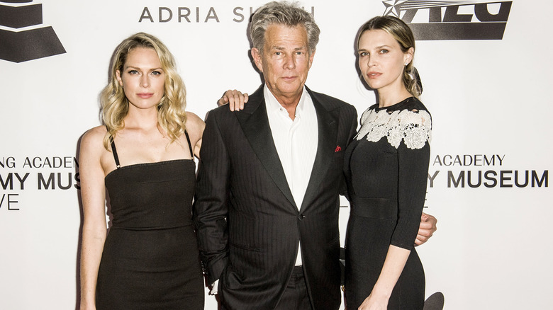 David Foster posing with his daughters