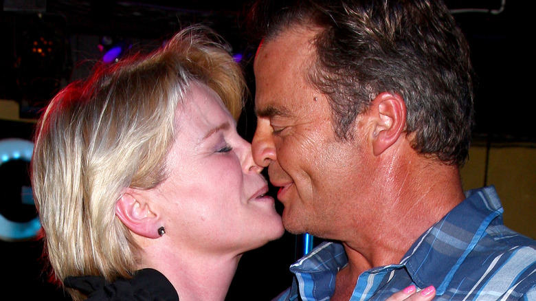 Judi Evans and Wally Kurth kiss at event